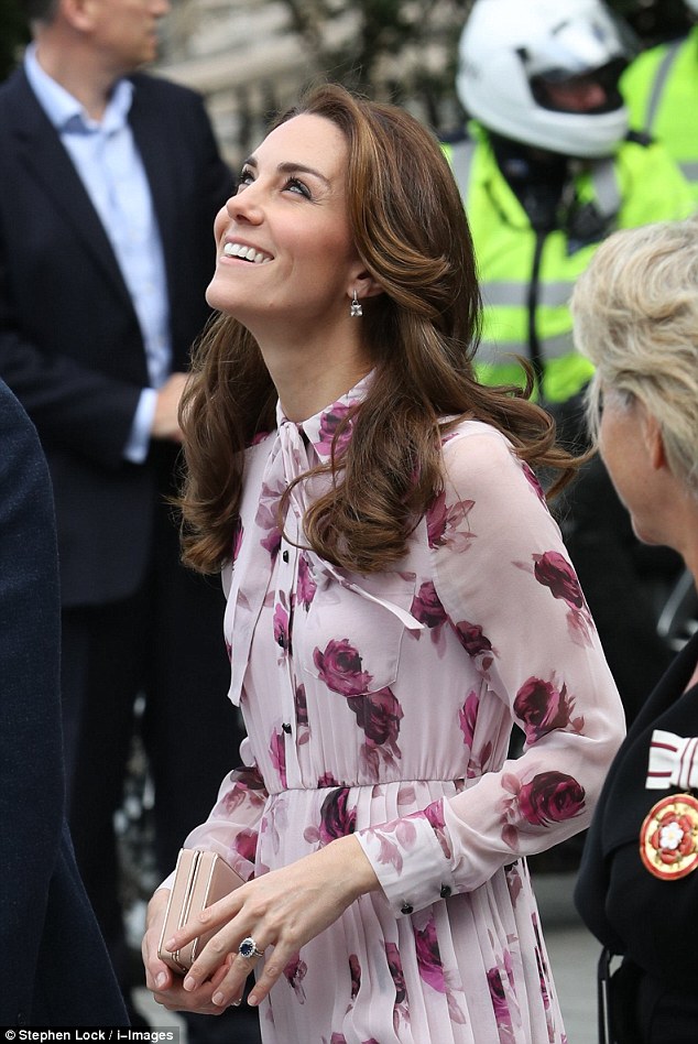 3943A56800000578-3831705-The Duchess glances up at The London Eye which will later be lit-a-21 1476145845781