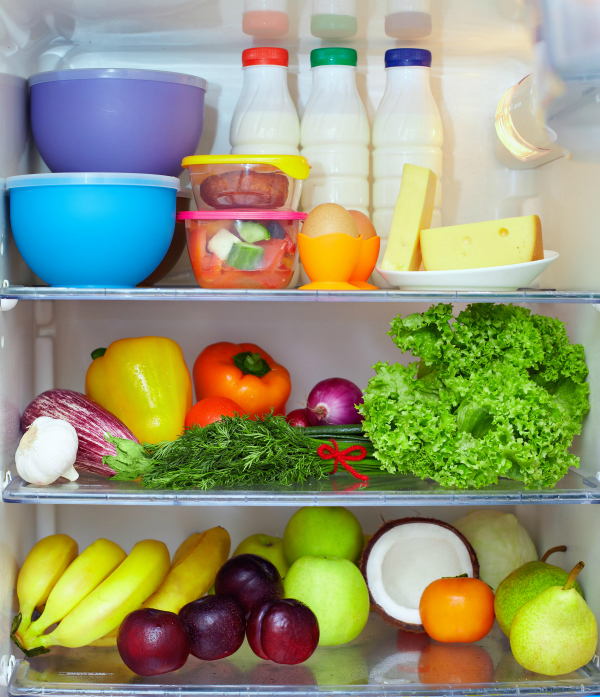 refrigerator full of healthy food. fruits, vegetables and dairy products