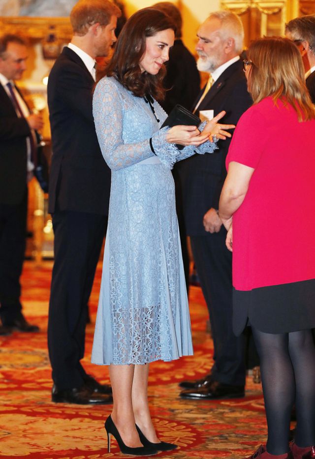 kate-middleton-just-debuted-her-baby-bump-in-a-pretty-lace-dress-2457885.640x0c